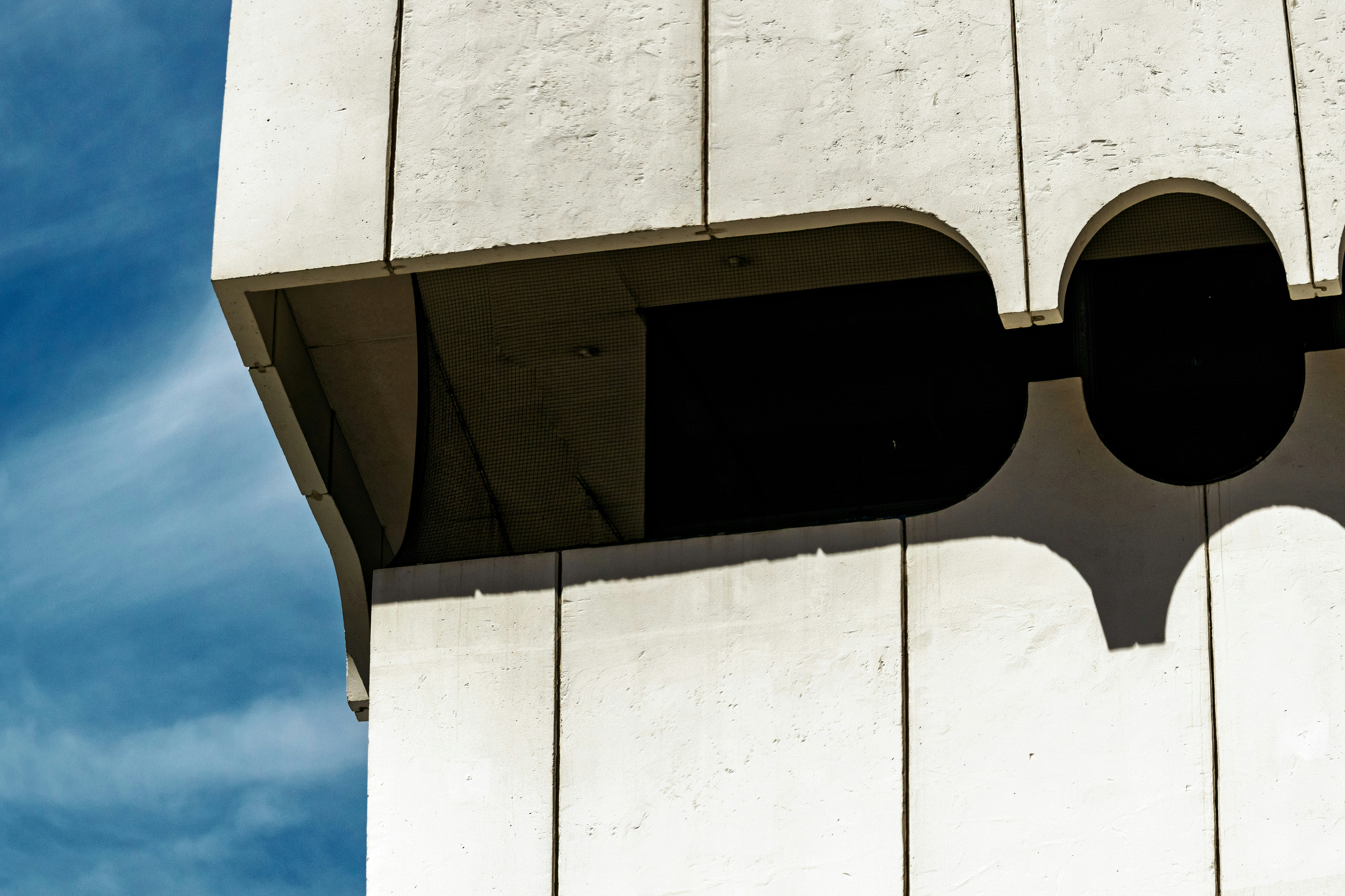 white concrete building under blue sky during daytime